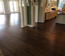 Sanded, stained, and refinished red oak plank flooring