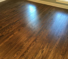 Sanded, stained, and refinished red oak plank flooring
