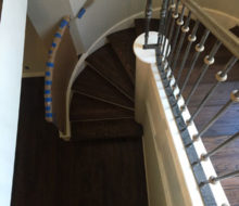 Sanded, stained, and refinished red oak plank flooring & stair treads