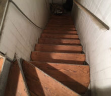 Sanding old wooden stair treads