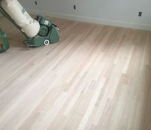 Sanding old red oak wooden flooring