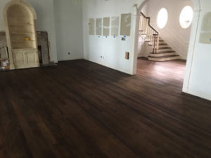 Stained and refinished red oak wood flooring and stair treads