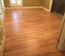 Old, yellowed red oak wood flooring prior to refinishing