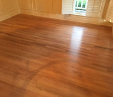 Old, yellowed red oak wood flooring prior to refinishing