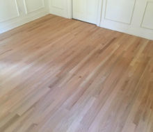 Sanded red oak wood flooring.