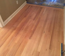 Sanded red oak wood flooring.