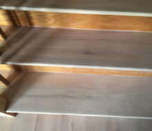 Whitewashed refinished wooden stair treads.