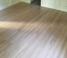 Whitewashed refinished red oak wood flooring.