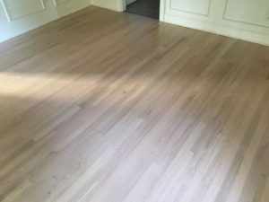 Whitewashed refinished red oak wood flooring.