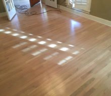 Whitewashed refinished red oak wood flooring.