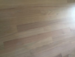 Whitewashed refinished red oak wood flooring.