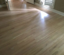 Whitewashed refinished red oak wood flooring.