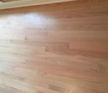 Whitewashed refinished red oak wood flooring.