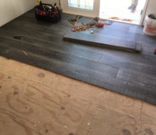 Beachy look White Oak flooring being installed