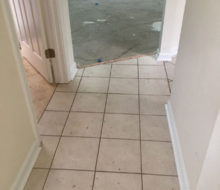 Carpeting removed, tile coming out