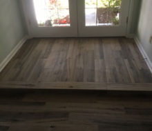 Hickory wood look floor tile installed - elevated floor/step