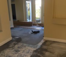 Installing quarter sawn red oak wood flooring on the leveled concrete subfloor