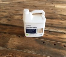 Bona NordicSeal sealer container on reclaimed Heart Pine floor