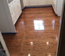 Finished solid Red Oak plank flooring with walnut pegs