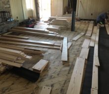 Red oak planks with walnut pegs being installed