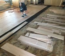 Red oak planks with walnut pegs being installed