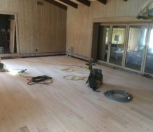 Sanded solid red oak plank, walnut pegged floor