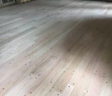 Sanded solid red oak plank, walnut pegged floor