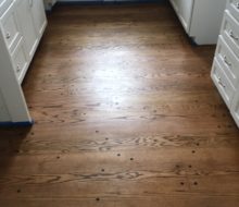 Stained and finished solid Red Oak plank flooring with walnut pegs
