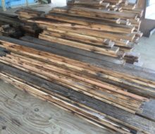 Various length/width reclaimed heart pine flooring prior to installation