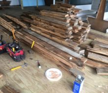 Various length/width reclaimed heart pine flooring prior to installation