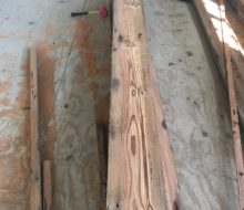 Various length/width reclaimed heart pine flooring prior to installation