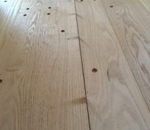 Walnut pegged red oak plank flooring w/ coin spacers