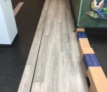 Installing vinyl plank flooring in Manatee Cafe