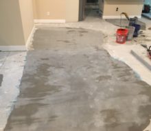 Leveling concrete slab subfloor