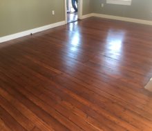 Refinished and restored old heart pine plank flooring