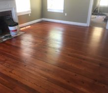 Refinished and restored old heart pine plank flooring