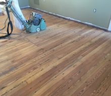 Sanded water damaged old heart pine plank flooring