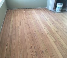 Sanded water damaged old heart pine plank flooring