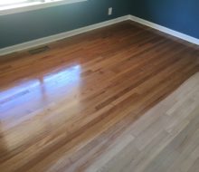 Applying finish to sanded solid red oak clear grade flooring