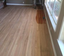 Applying finish to sanded solid red oak clear grade flooring