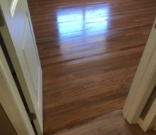 Applying finish to sanded solid red oak clear grade flooring