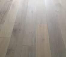 Installed wire brushed oak hardwood flooring