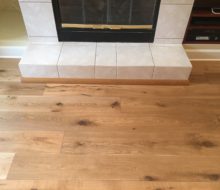 Wire brushed white oak character grade wood flooring installed