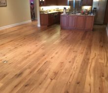 Wire brushed white oak character grade wood flooring installed