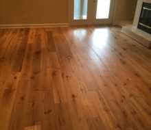 Wire brushed white oak character grade wood flooring installed