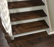 Installed hardwood Maple flooring and matching solid Maple stair treads