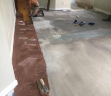 Birch wood floor installation over leveled subfloor