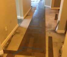 Wood floor installation w/ straps for wide birch plank flooring