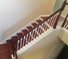 New Brazilian Cherry stair treads - custom stained and installed with new wood flooring on landing and upstairs hall