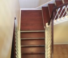 New Brazilian Cherry stair treads - custom stained and installed with new wood flooring on landing